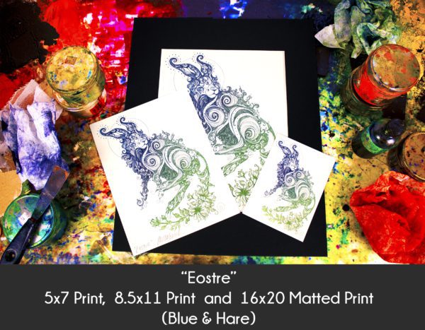 Photo of Rabbit art Eostre Hare products in 5x7 Print, 8.5x11 Print and 16x20 matted print on an etching inking station to display size differences